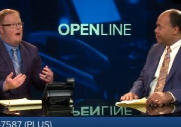 Two men discuss on a TV show called OPENLINE.